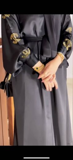 This kimono silhouette has been crafted from rich black Nida fabric with golden arabic and chanel embroidery. Chanel Embroidery, Abaya Style, Open Abaya, Eid Ramadan, Embroidered Kimono, Streetwear Shop, Business Tops, Scarf Sale, Abaya Dress