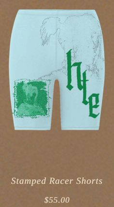 the back of a white shorts with green letters on it and an image of a man's face