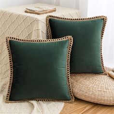 two green pillows sitting on top of a wooden floor