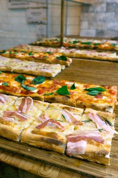 several slices of pizza are arranged on a table