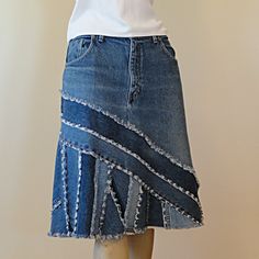 a mannequin wearing a skirt made out of old jeans with fraying on the bottom