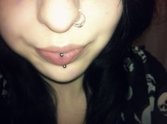 a close up of a person with a nose piercing