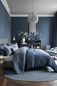 Transform your Home with elegant Grey and Blue Bedroom Ideas. Find the best Home Décor tips and Bedroom Inspirations to create a serene and modern space. Perfect for all Bedroom Ideas! Charcoal Blue Bedroom, Blue Grey Paint Color For Bedroom, Blue Gray Bedroom, Minimalist Bedroom Ideas, Blue Bedroom Ideas, Dark Blue Bedrooms, Cozy Bedroom Ideas