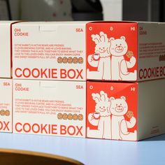 three boxes of cookies are stacked on top of each other, with the same box labeled cookie box