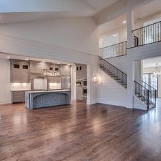 a large open floor plan with stairs and an island in the middle is on instagram