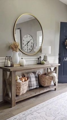 the entryway is decorated with baskets and a clock