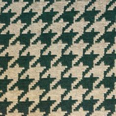 an up close shot of a green and white houndskin pattern on a fabric material