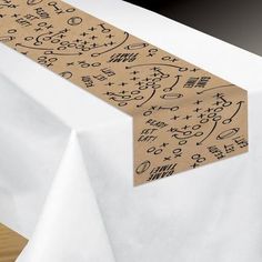 a white table with a brown and black design on it