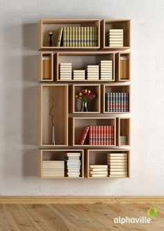 a bookshelf filled with lots of books on top of a wooden floor