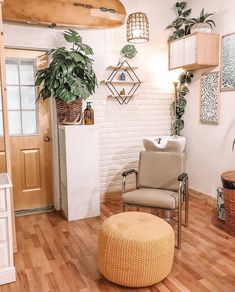 a living room filled with furniture and plants