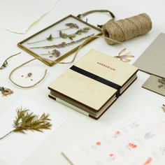 various items are laid out on the table to be used for crafts and handmade cards