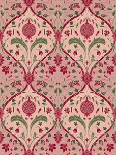 a red and green floral pattern on pink fabric