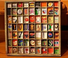 a wooden box filled with lots of different types of beer bottles and magnets on top of a table