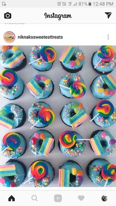 cupcakes decorated with rainbow icing and sprinkles are displayed on the instagram page