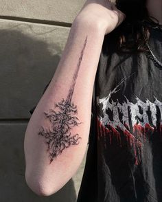 a person with a tattoo on their arm