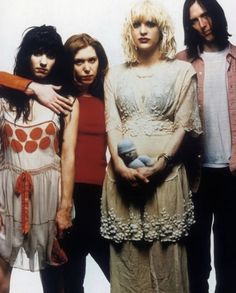 the runaways posing for a photo in front of a white background with their arms around each other