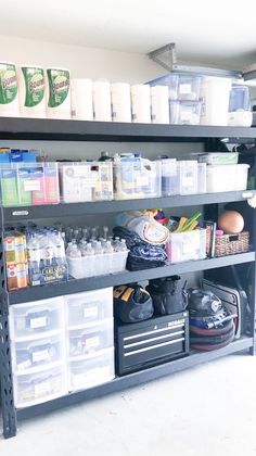 the shelves are full of cleaning products and other things to use in this garage storage area