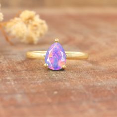 Lavender fire Ethiopian opal ring for women, October birthstone opal jewelry, Minimalist ring, ring for her, Genuine fire opal ring, Minimalist ring, Ring for her Gorgeous fire opal jewelry, Gemstone ring, Gift for her. *Other Similar Jewelry Available Here* https://www.etsy.com/shop/AreebaJewelry Details:- Gemstone - Ethiopian opal  Stone Color - Natural  Stone Setting - Prong Quality - AAA Grade Rize Size - 4 US TO 9 US Available Type - 100% Natural  Shipping service - Free worldwide shipping Teardrop Opal Ring As A Gift, Fine Jewelry Opal Rings In Pear Shape, Anniversary Solitaire Opal Ring, Pear-shaped Opal Rings Fine Jewelry, Opal Open Ring Birthstone, Pear-shaped Opal Gemstone Ring, Ethiopian Opal Promise Ring Birthstone, Ethiopian Opal Birthstone Promise Ring, Solitaire Opal Ring In Round Shape