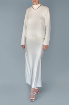 The Long Silk Satin Maxi Skirt in Ivory is a closet workhorse. Paired with your favorite blouse or t-shirt, it will carry you through each season, a true staple in a timeless ankle length. An elastic waistband allows you to wear it at your true waist or low on the hips. Fully lined for complete coverage. Shown styled with our Lucie blouse in Ivory. Very limited quantities. CARE & INFO Dry clean only 100% silk satin Bias cut Fully lined SIZING NOTES True to size, take your usual size Elasticized Maxi Slip Skirt, Satin Maxi Skirt, Slip Skirt, Satin Maxi, Skirt Fits, Designer Outfits Woman, Silk Satin, Long Skirt, Silk Dress