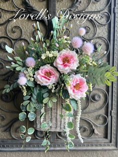 Handcrafted Silk Flower Wall Basket Arrangement - Pink real feel roses, Eucalyptus, and Baby's Breath and beautiful folliage.  Add a touch of elegance to your home decor with this handcrafted wall basket arrangement. This beautiful arrangement features lifelike pink roses, eucalyptus leaves, and delicate baby's breath, all artfully arranged in a charming wicker basket. Perfect for any room, this silk flower arrangement offers a maintenance-free way to enjoy the beauty of fresh flowers year-round Wall Basket With Flowers, Front Door Baskets With Flowers, Door Baskets With Flowers, Spring Arrangements Floral, Front Door Hanging Basket, Door Hanging Basket, Hanging Basket Ideas, Silk Flower Wall, Door Baskets