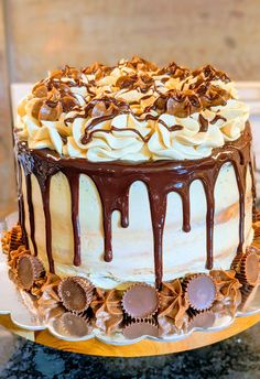 a cake with chocolate icing and nuts on top