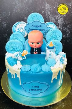 a blue cake with a baby on it