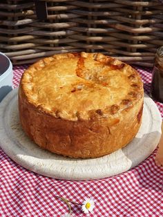 a pie sitting on top of a white plate