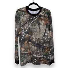 a camo sweater hanging on a hanger