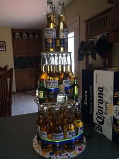 a stack of beer bottles sitting on top of a table