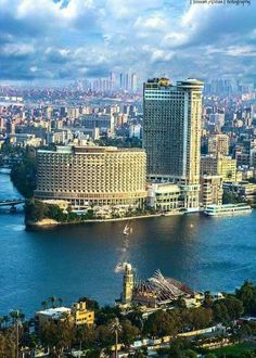 an aerial view of the city and river