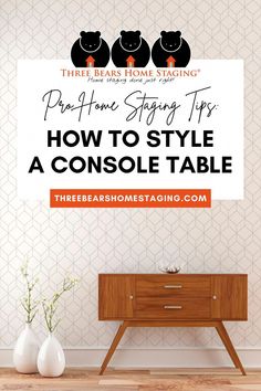 a table with two vases and a sign that says how to style a console table