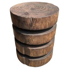 three wooden stools stacked on top of each other in the shape of circles and spirals