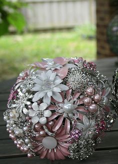 a bridal bouquet sitting on top of a wooden table