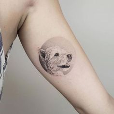 a dog's head is shown on the left side of the arm, with a circle around it