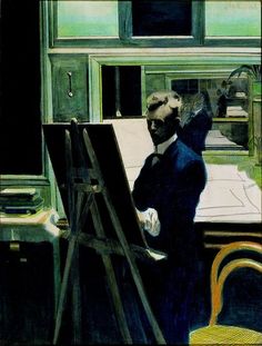 a man standing in front of an easel painting