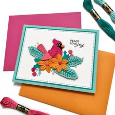 a card with a bird on it and tassels next to some other cards