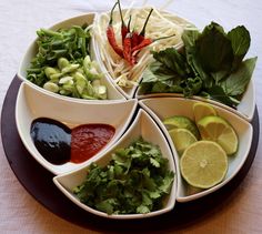 four bowls filled with different types of food