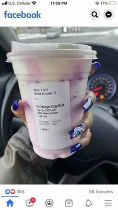 a woman holding up a cup of ice cream in her hand with the words facebook on it