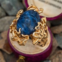 This vintage freeform ring features an oval cabochon cut sodalite gemstone set in the center of ribbon style gold work that mimics ocean waves. The ring is crafted in 14k yellow gold and is currently a size 11. Jewelry Smithing, Sodalite Ring, Freeform Ring, Ribbon Style, Vintage Waves, Gold Work, Oval Cabochon, Ocean Waves, Vintage Rings