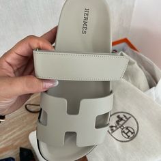 Authentic Brand New Worn Once Hermes Chypre Sandals In Grey Leather. Selling Because They Are Too Big For Me. Absolutely No Signs Of Wear. Hermes Chypre Sandals Grey Calfskin Leather (Beige Esquisse) Size 37 Techno-Sandal In Calfskin With Anatomical Rubber Sole And Adjustable Strap. A Sleek Design For A Comfortable And Casual Look. Made In Italy Hermes Sandals, Grey Sandals, Hermes Shoes, Grey Leather, Things To Buy, Casual Look, Sleek Design, Calf Skin, Casual Looks