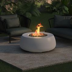 a fire pit sitting on top of a cement slab