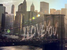 an image of the brooklyn bridge in new york city, with lights reflecting off it