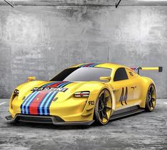 a yellow sports car with blue and red stripes on it's side in a parking garage