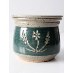 a ceramic bowl with flowers painted on it