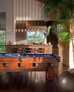 a pool table in the middle of a room