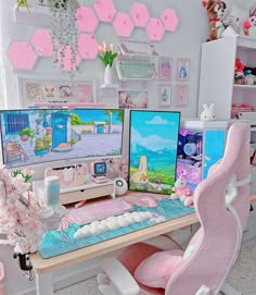 two computer monitors sitting next to each other on top of a desk in a room