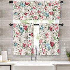 a kitchen window curtain with flowers on it