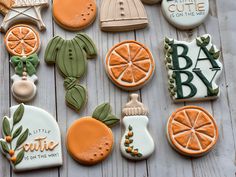 many decorated cookies on a wooden table