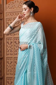 Iris Light Blue Georgette Foil Print One Minute Saree Light Blue Unstitched Blouse Piece For Festive Occasions, Blue Pre-draped Saree With Unique Design For Eid, Blue Pre-draped Saree With Self Design For Eid, Blue Chanderi Choli With Self Design, Bollywood Style Light Blue Blouse Piece With Traditional Drape, Festive Blue Blouse Piece With Sheer Dupatta, Light Blue Blouse Piece With Dupatta For Diwali, Blue Pre-draped Saree With Pallu For Eid, Blue Cutdana Blouse For Eid