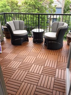 two chairs and a table on a deck